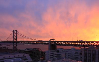 Sunrise behind the San Francisco-Oakland Bay Bridge.